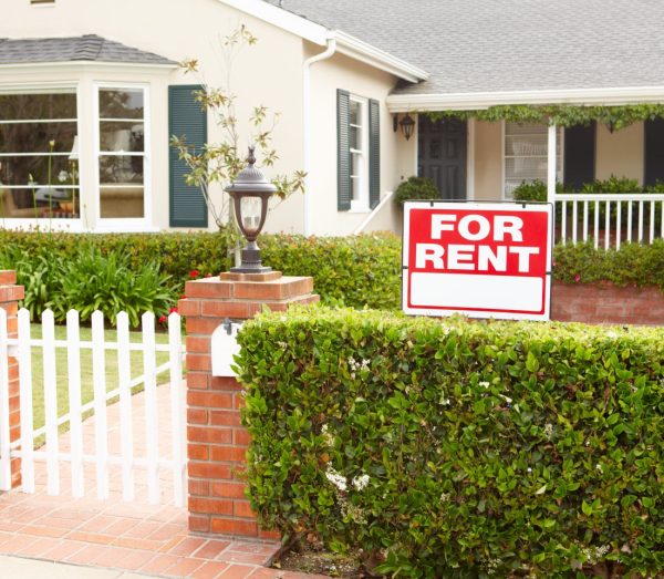 Image of home with picket gate and for rent sign